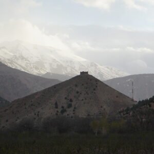 Mountain landscape with distant snow peaks