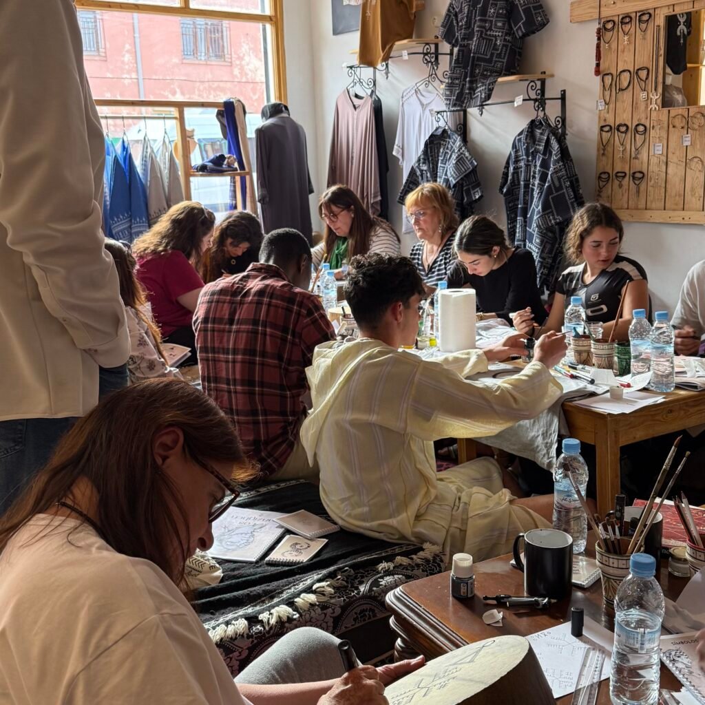 Travelers creating art in boutique studio