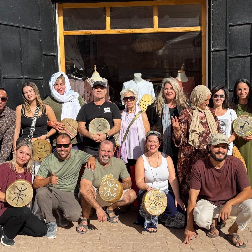 Travelers with painted drums in Morocco.