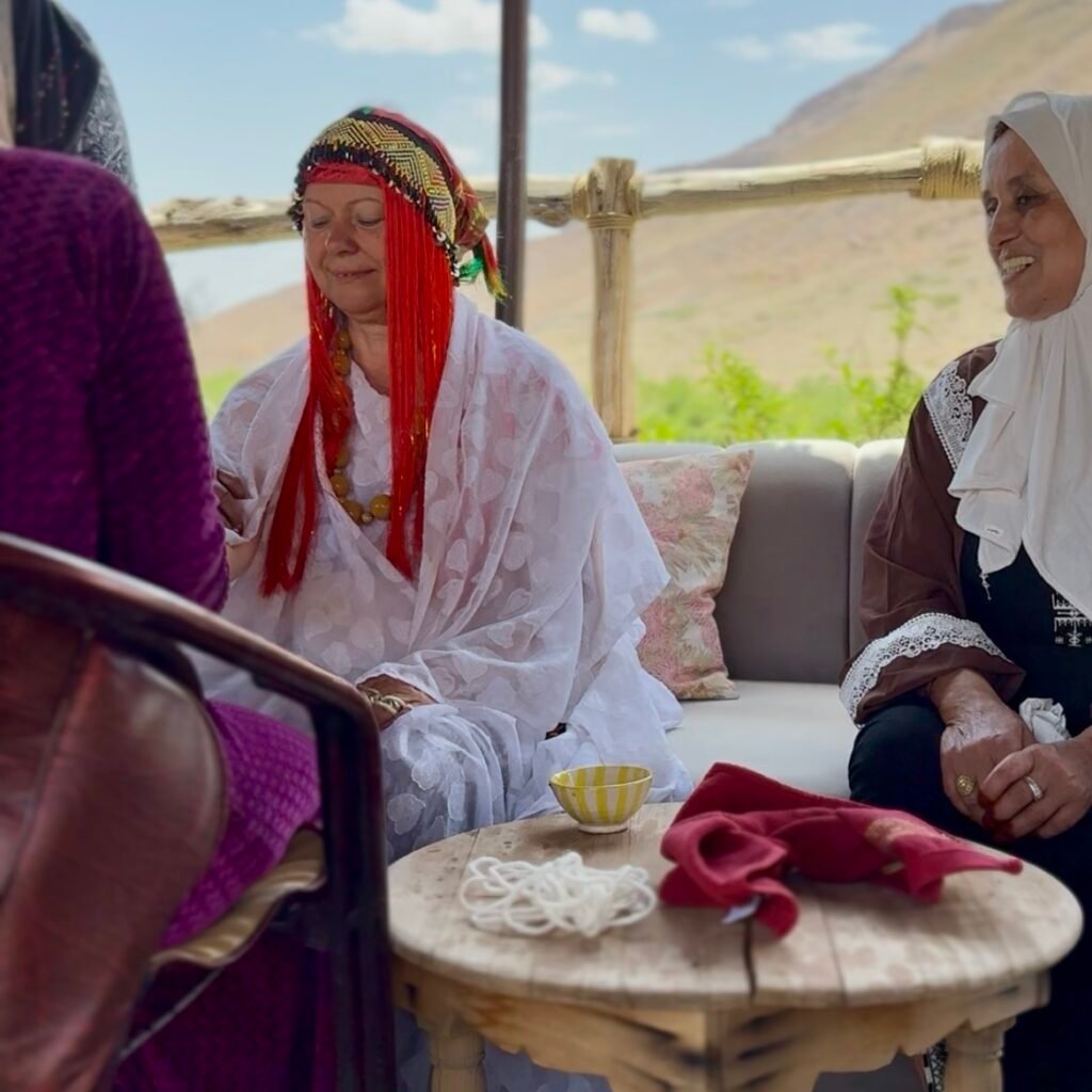 Women in traditional attire, sitting together