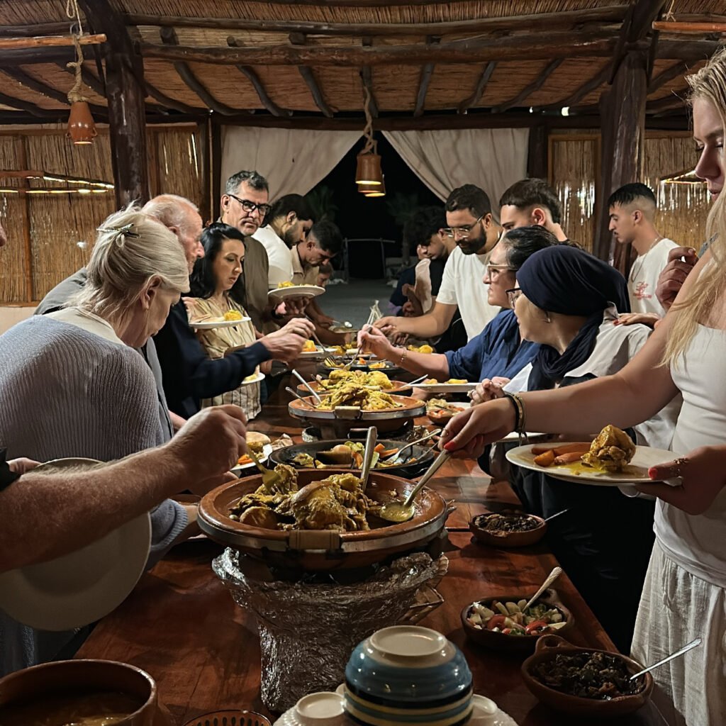People selecting dishes from a warm buffet featuring tagines and local Moroccan cuisine