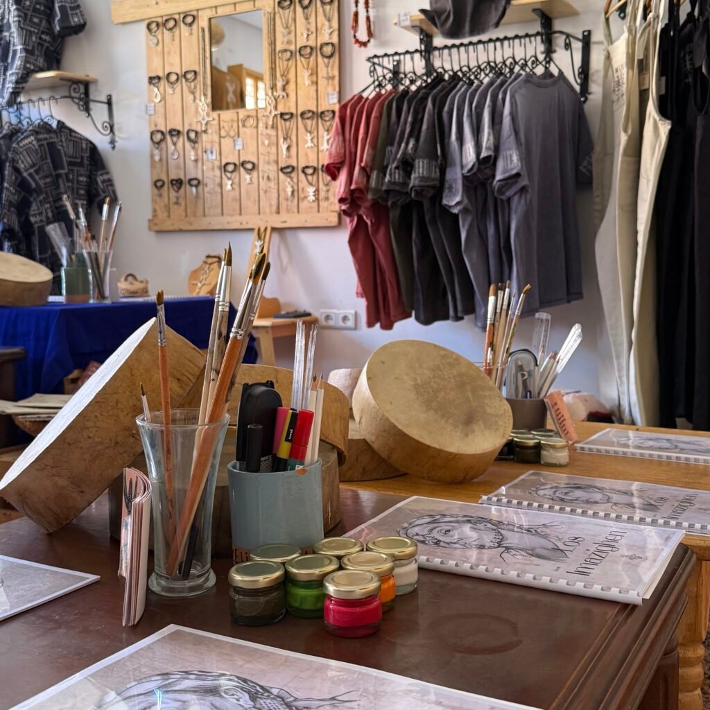 Art supplies and traditional instruments displayed.