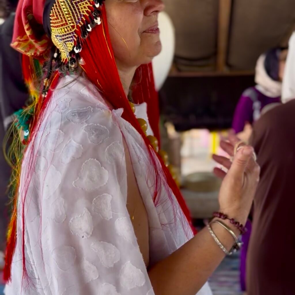 Woman in vibrant traditional Moroccan attire.