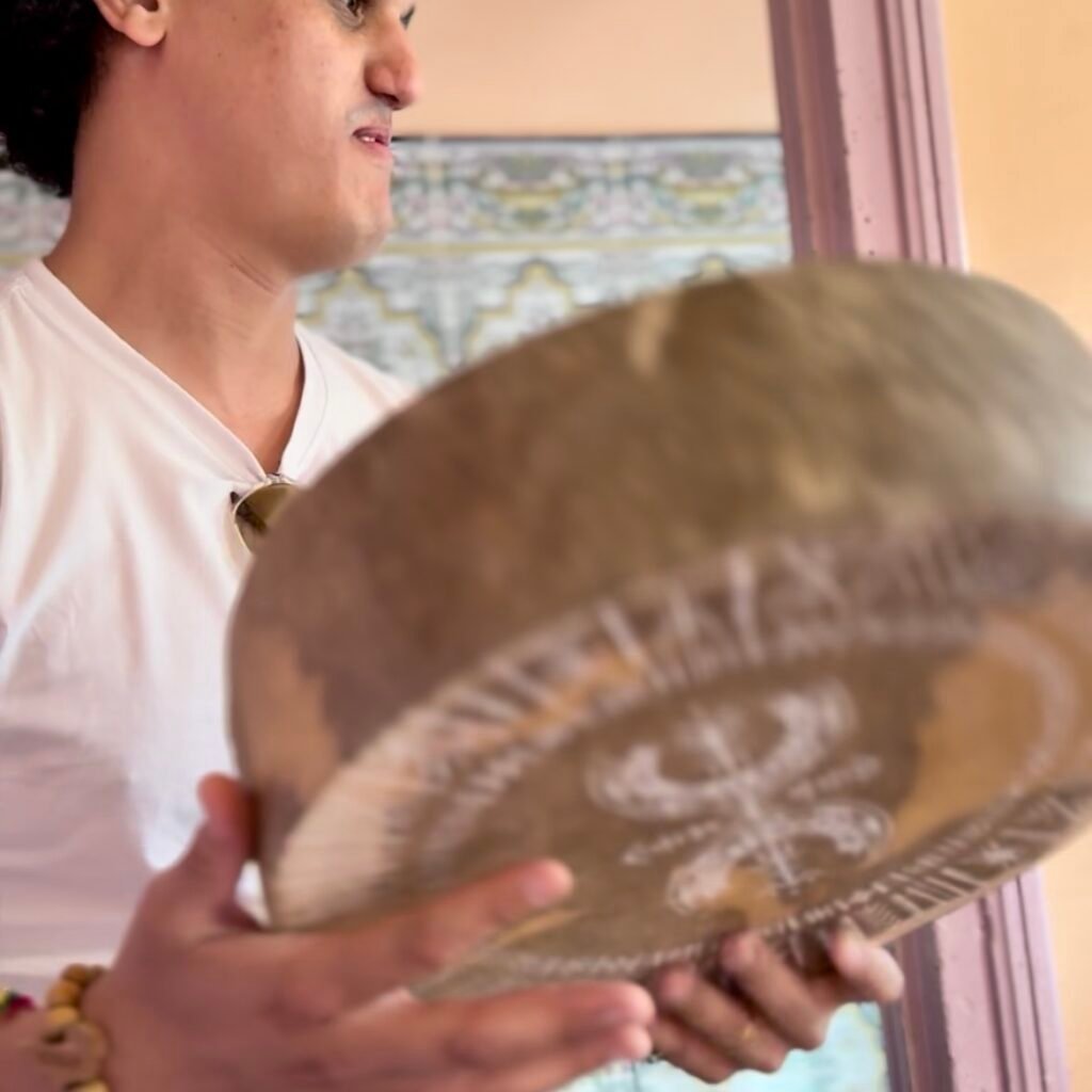 Young man playing traditional Moroccan drum